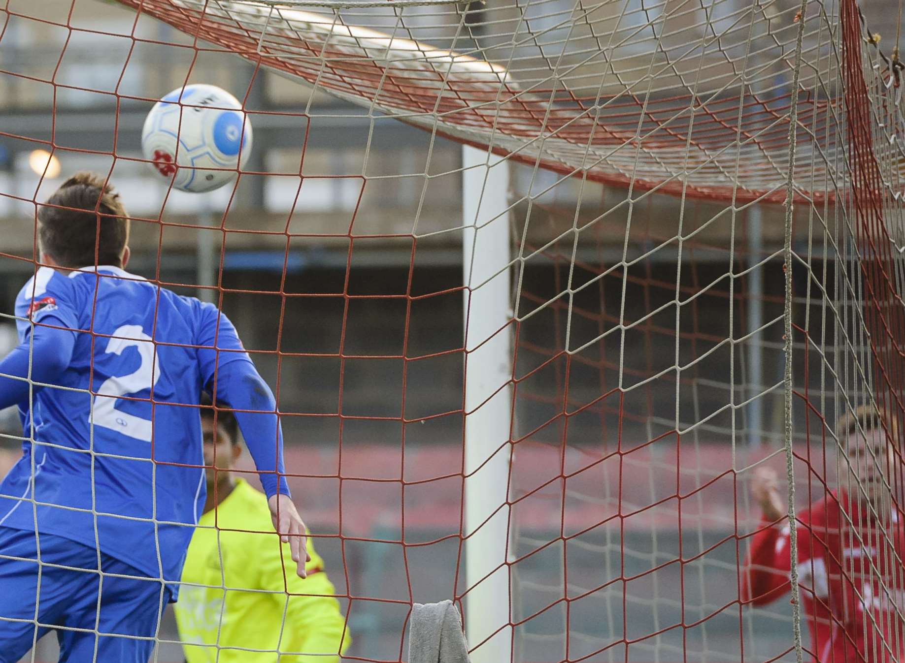 Charlie Sheringham (far right) watches his header go in off Harrow's Josh Webb for Ebbsfleet's third against Harrow