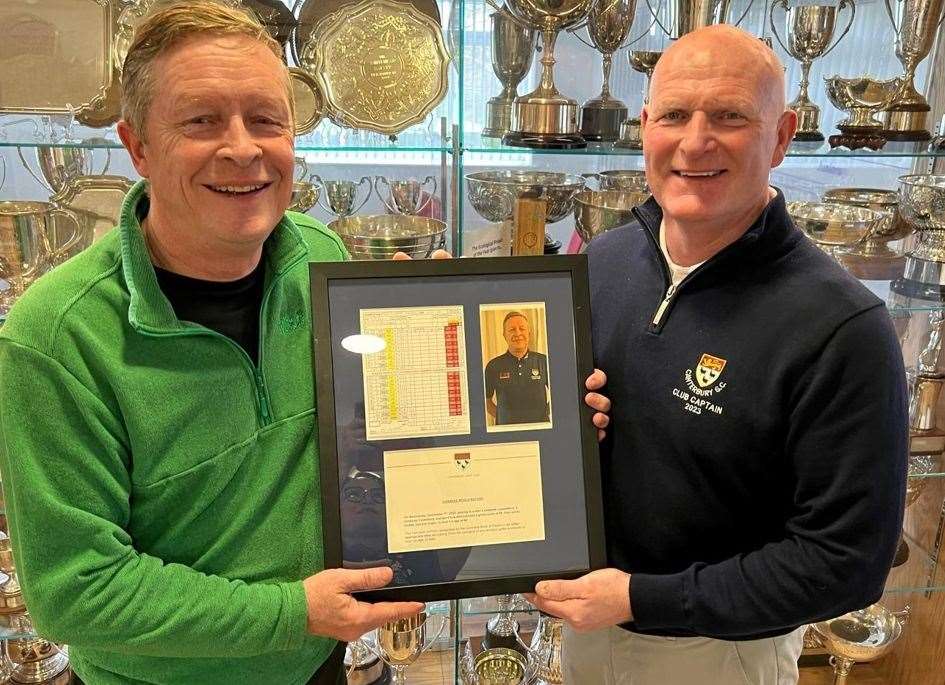 Chris Almond, left, receives a framed scorecard, picture and written declaration commemorating his record-busting gross 65 from last year's Canterbury Golf Club captain Mark Broadhurst