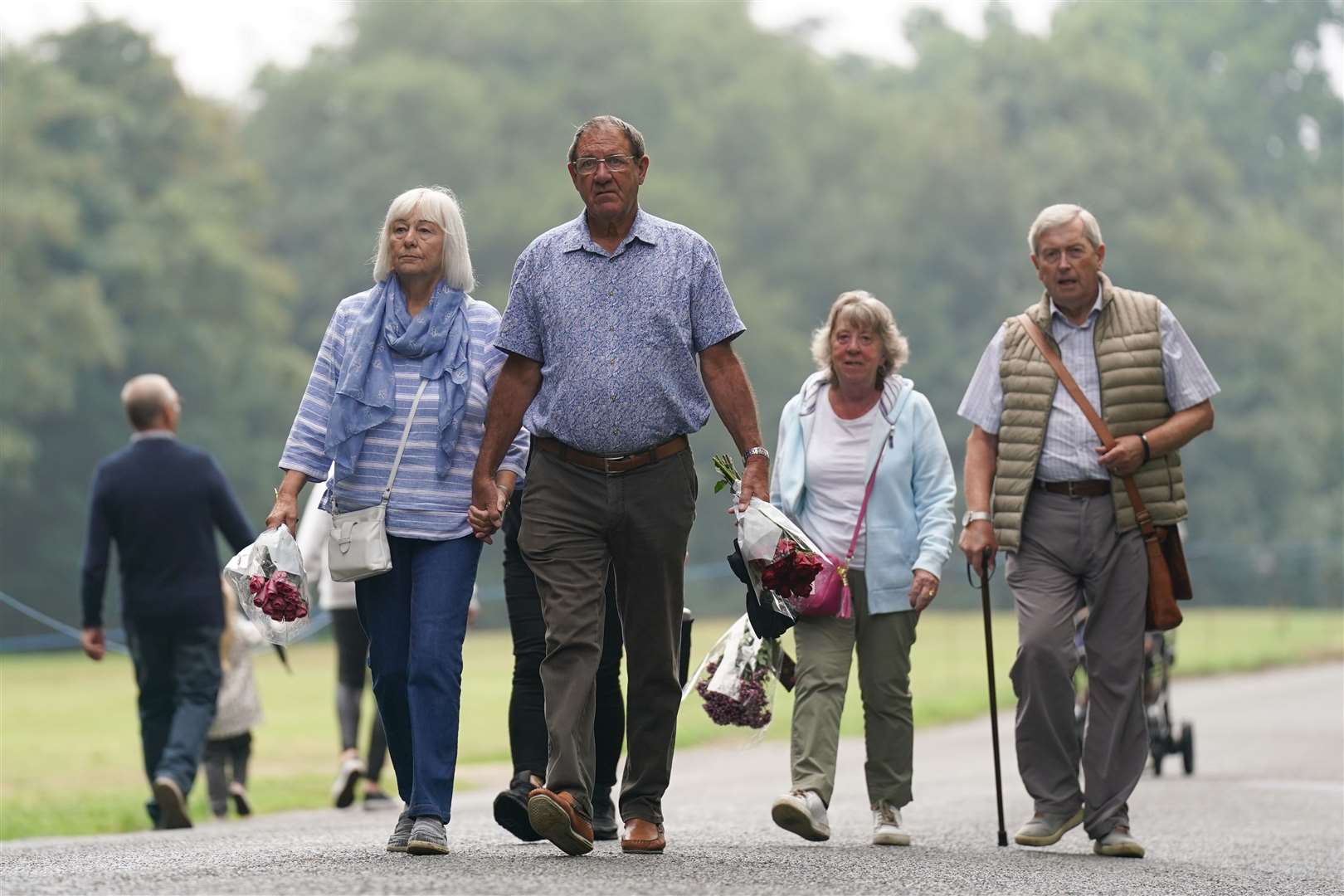 Mourners arrive to lay flowers and pay their respects at the Sandringham Estate in Norfolk (Joe Giddens/PA)