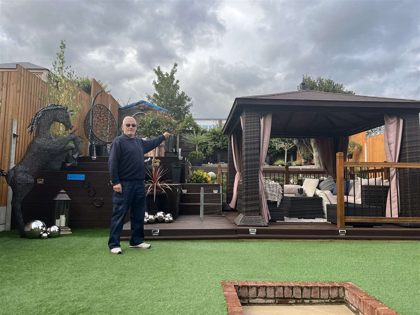 Clive Beach in his Coombe Drive home pointing to where the alleyway is