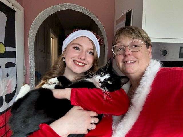 Karen Clayton with her daughter Carris and their cat, Silas. Picture: Karen Clayton