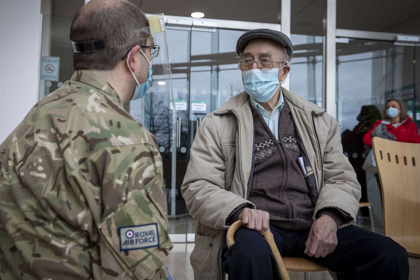 RAF veteran Ronald Maidment, 93, chatting to RAF personnel after receiving his coronavirus vaccination at Ty Penallta, Caerphilly ( Cpl Cathy Sharples/Ministry of Defence/Crown Copyright/PA)