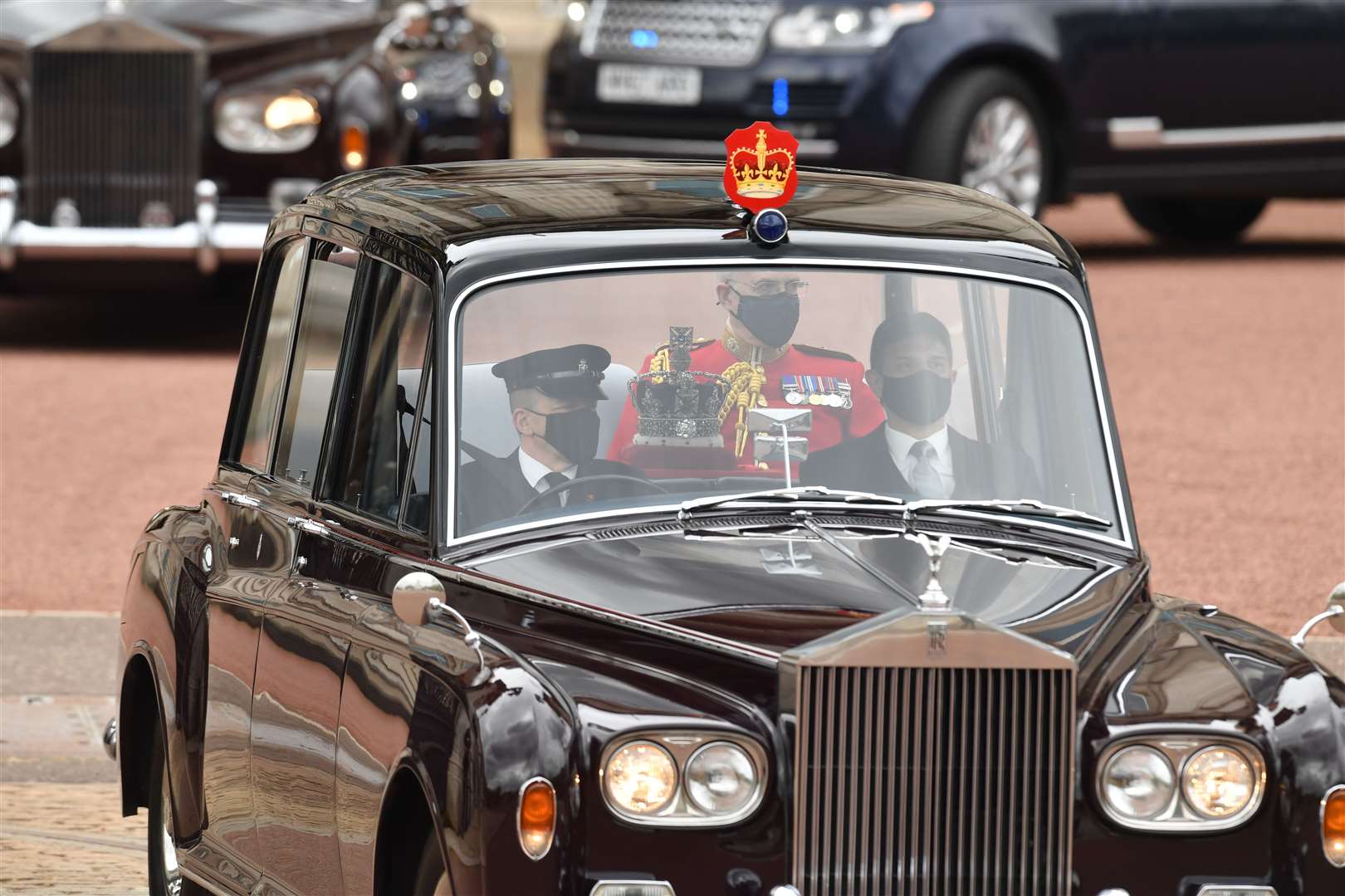 The Imperial State Crown leaves Buckingham Palace by car (Dominic Lipinski/PA)