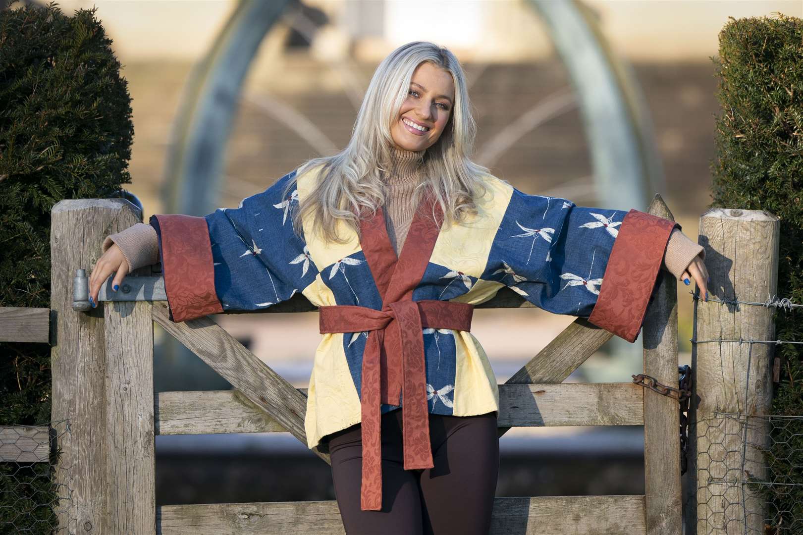 A bold denim blue and yellow damask short kimono made out of old royal curtains (Jane Barlow/PA)