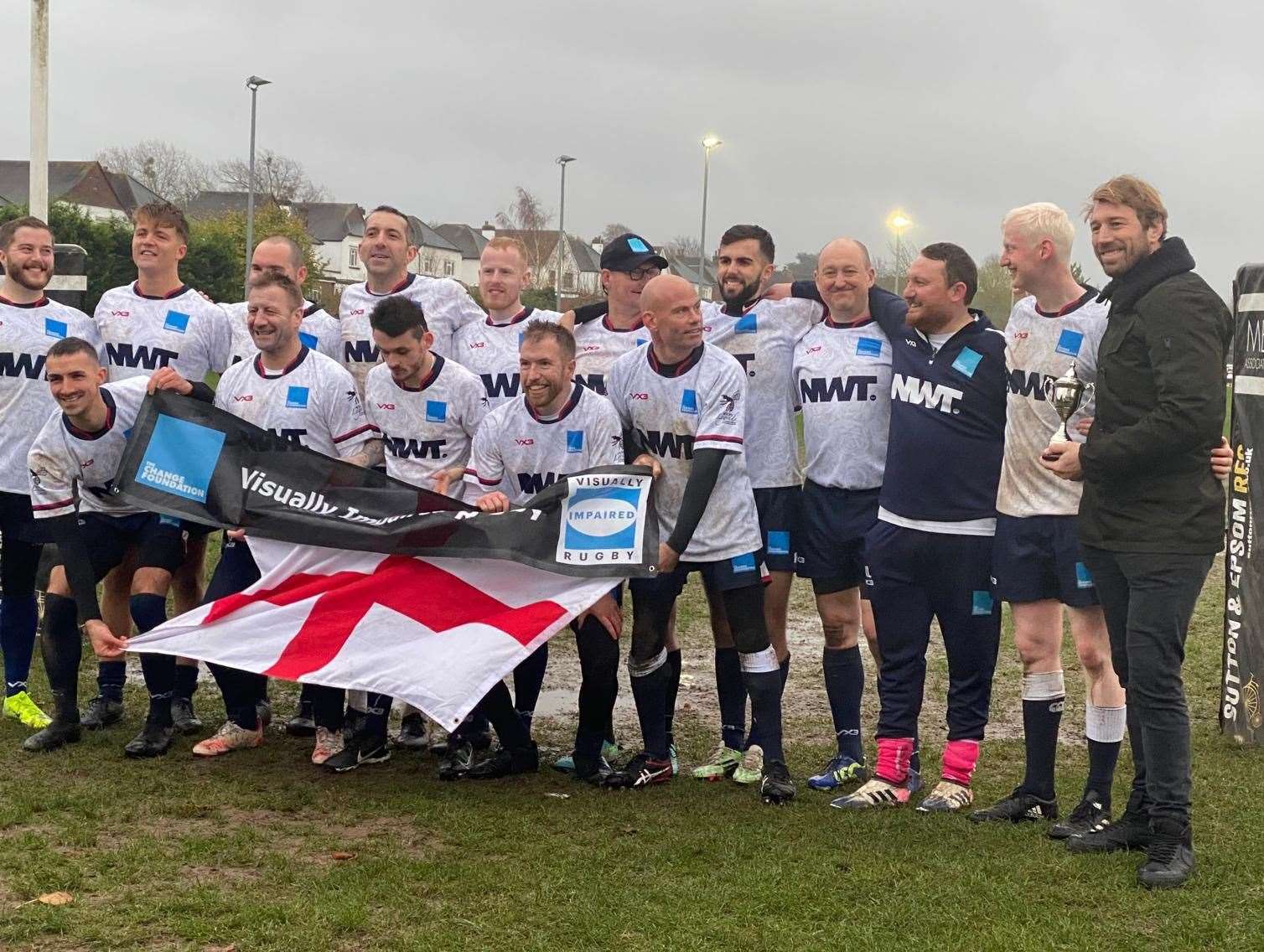 England's VI rugby team celebrate their success.