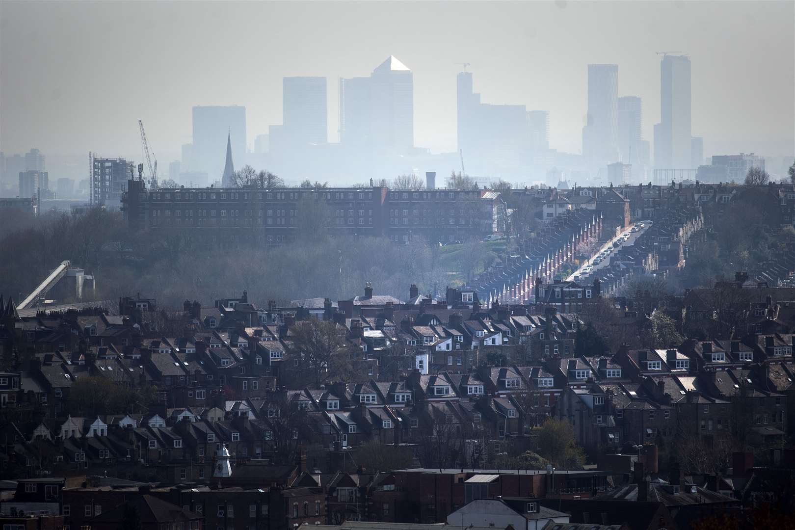 The Canary Wharf skyline viewed through the haze from Alexandra Palace