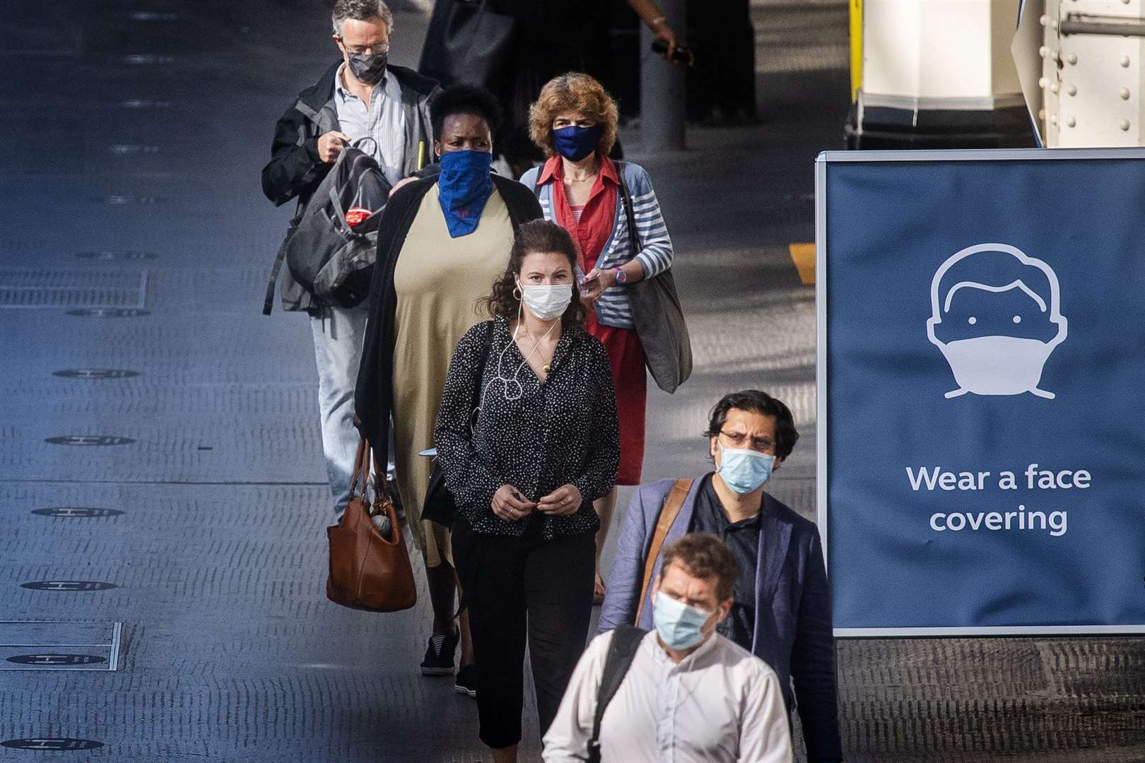 Face coverings are already mandatory on public transport in England (Victoria Jones/PA)