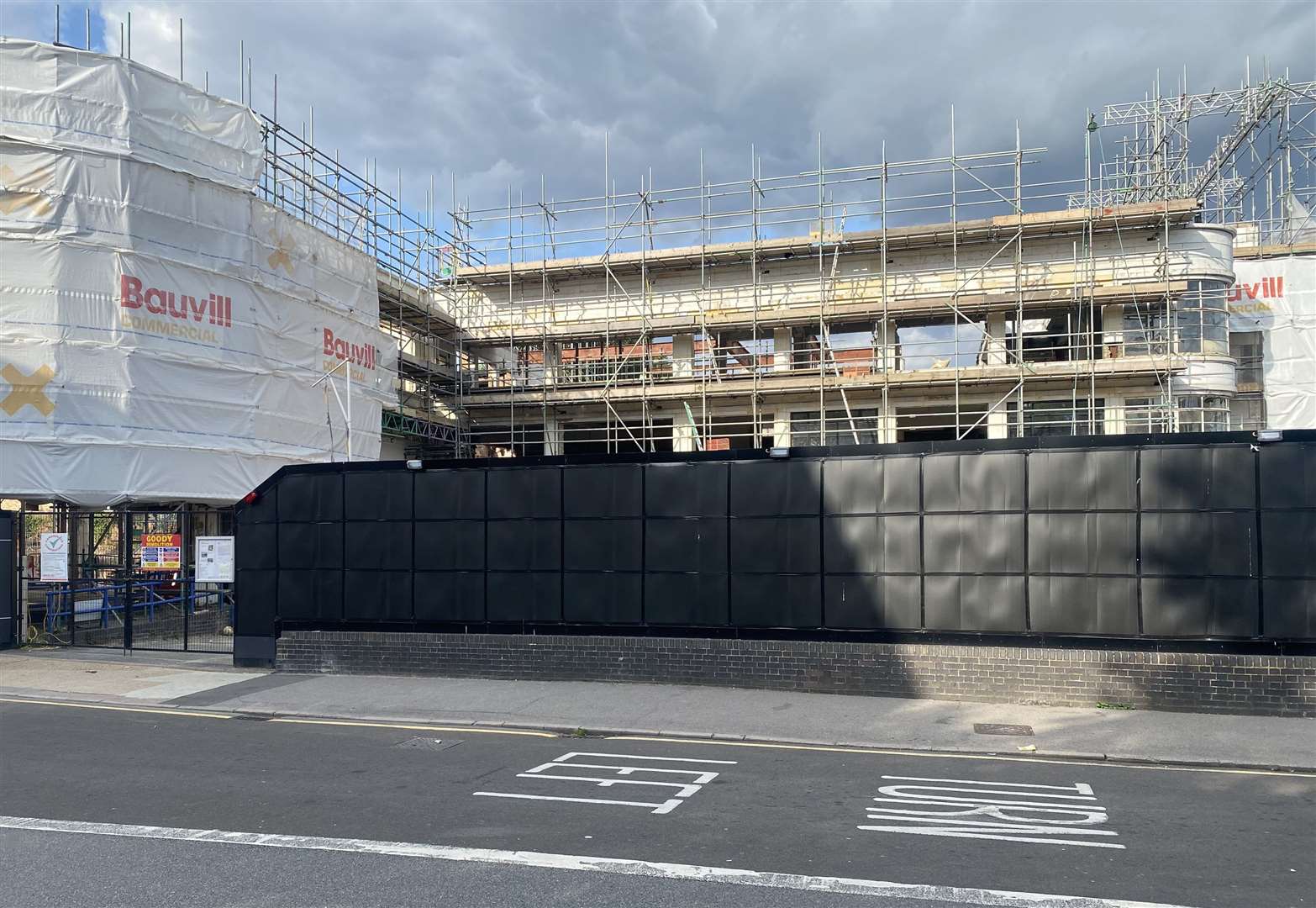 Black hoardings around Len House Maidstone