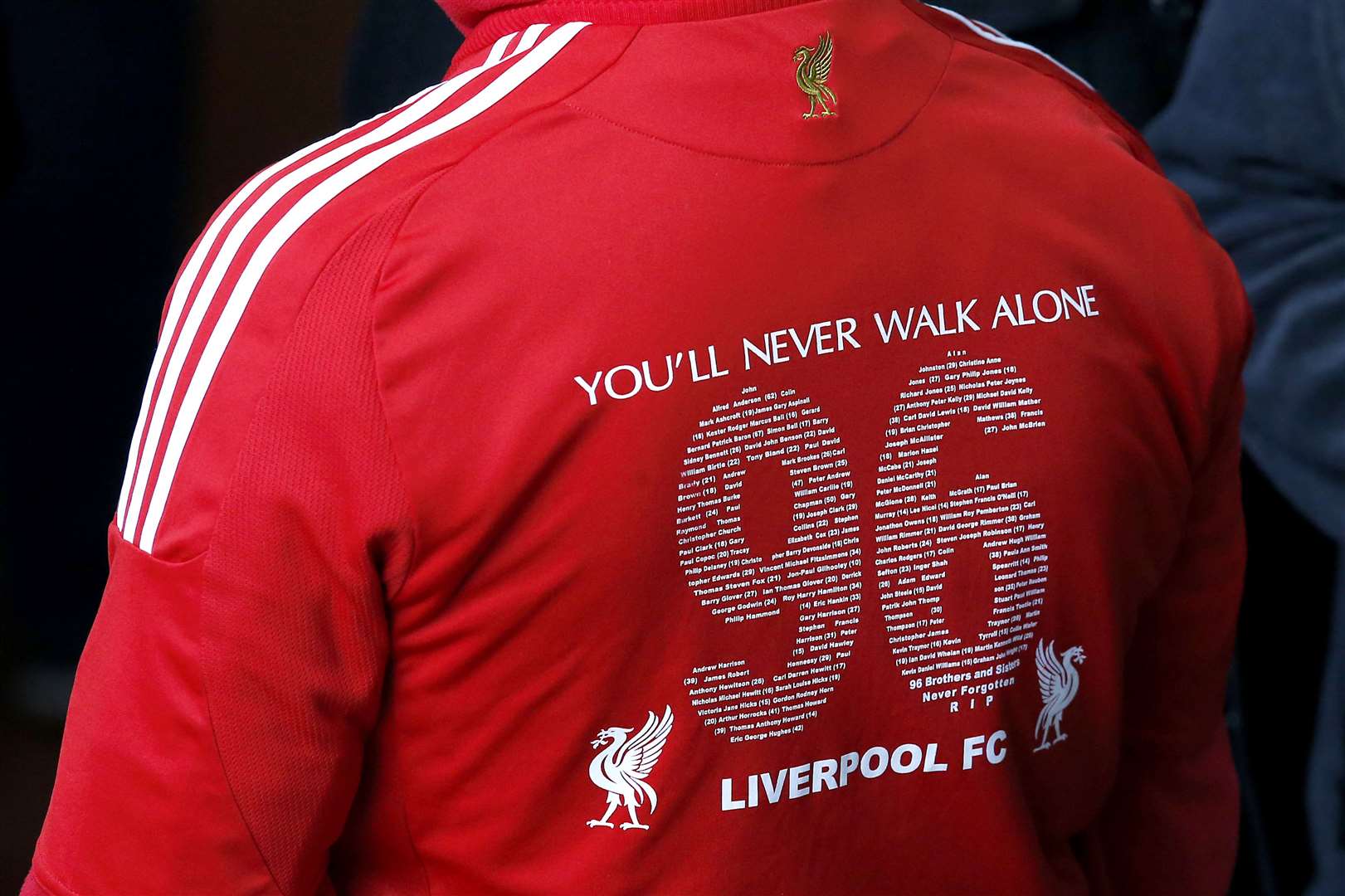 The congregation gathers before a memorial service at Anfield (Peter Byrne/PA)