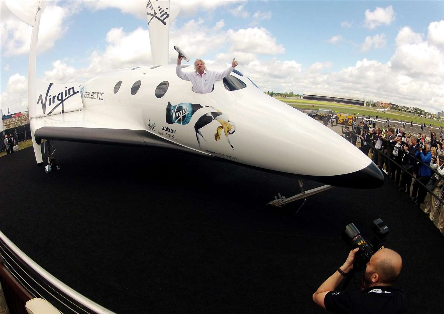 Sir Richard Branson poses on his Virgin Galactic spacecraft (Steve Parsons/PA)