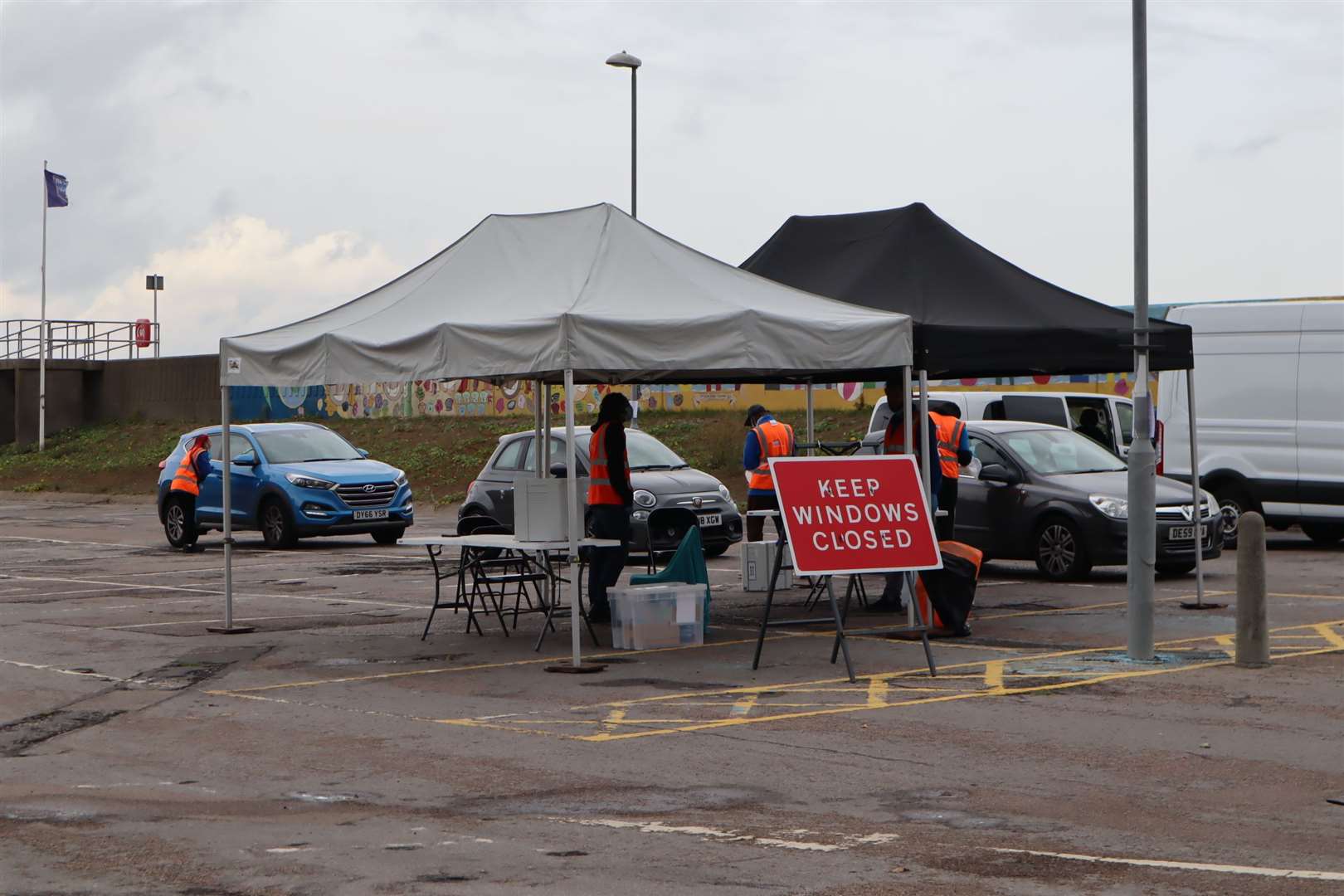 Three cars queuing for tests at the temporary coronavirus testing station in Beach Street, Sheerness, on Wednesday. Picture: John Nurden