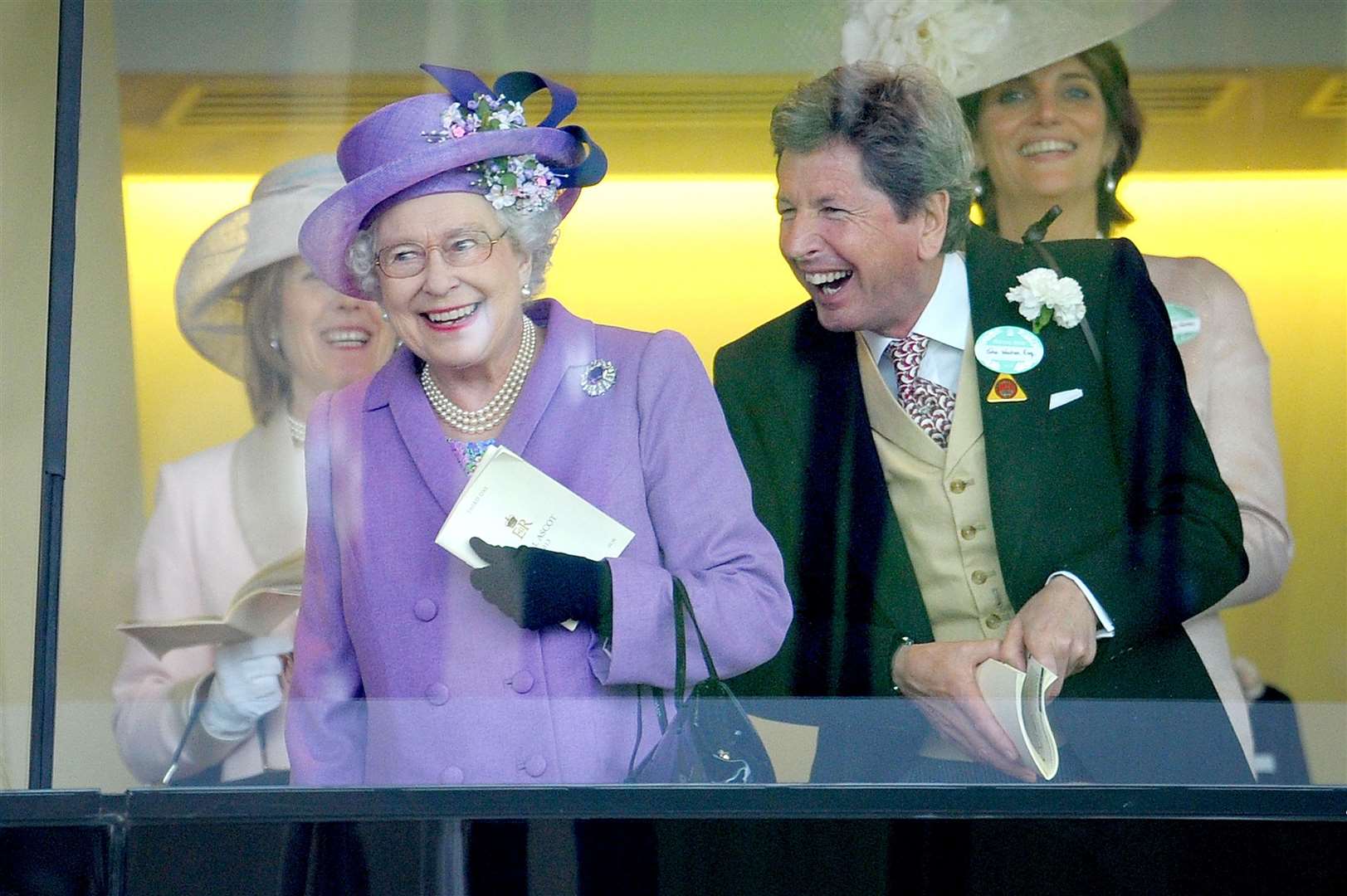 The Queen celebrating Estimate’s win with racing manager John Warren in 2013 (Tim Ireland/PA)