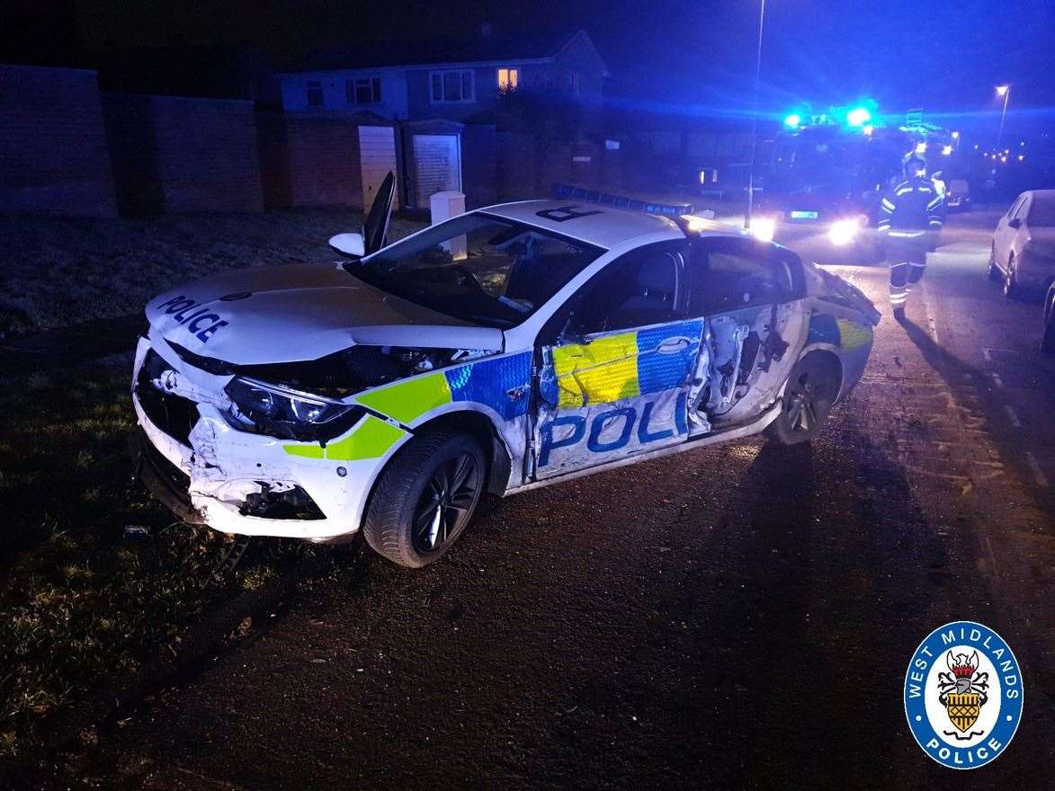 The wreck of a police car rammed seven times by a van in Coventry (West Midlands Police/PA)