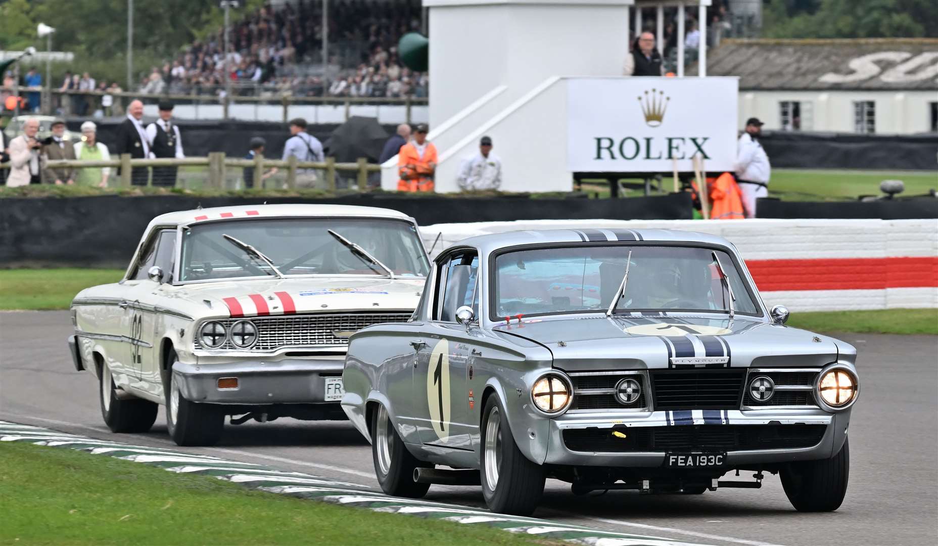 Jake Hill, driving a Plymouth Barracuda, defends against Roman Dumas in the St Mary's Trophy race. Picture: Simon Hildrew