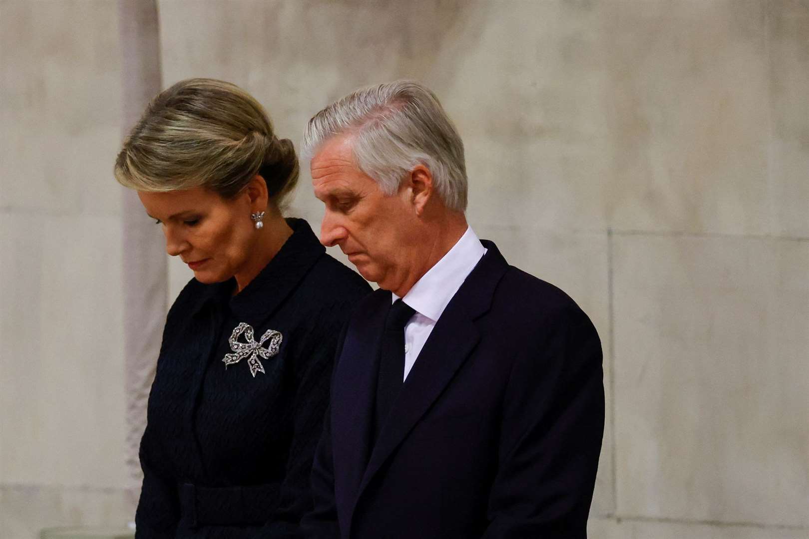 King Philippe and Queen Mathilde of Belgium view the coffin of Queen Elizabeth III (Sarah Meysonnier/PA)