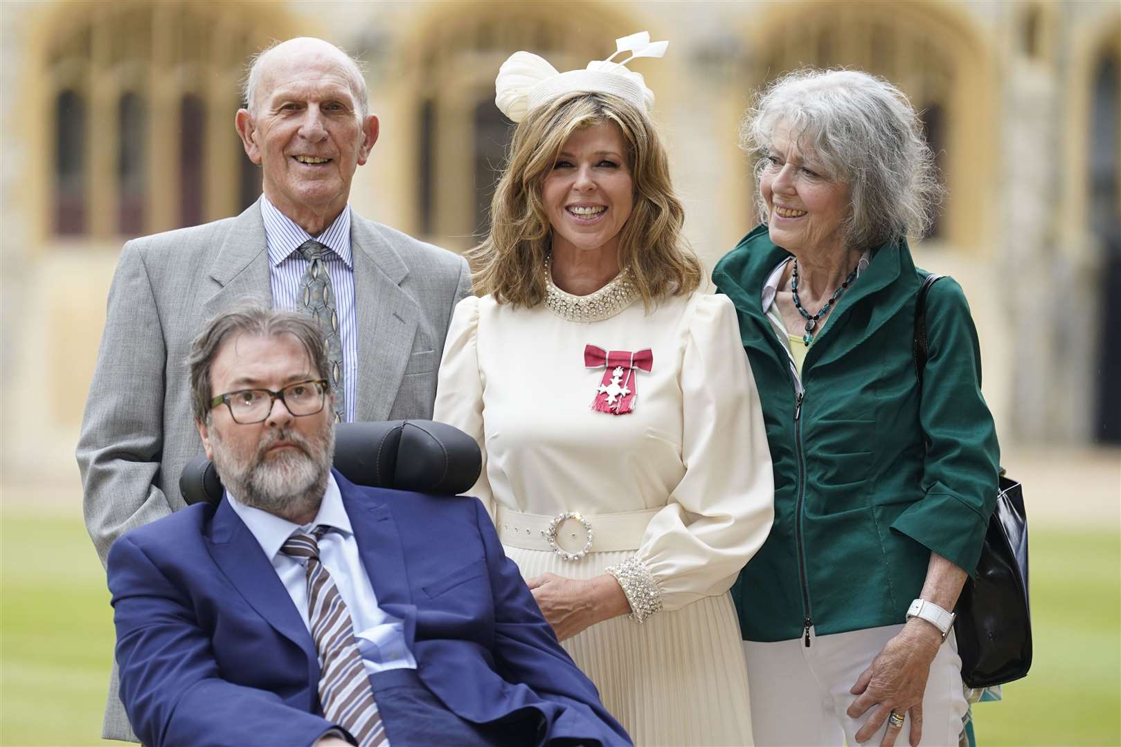 Kate Garraway, with her husband Derek Draper and her parents after being made an MBE (Andrew Matthews/PA)