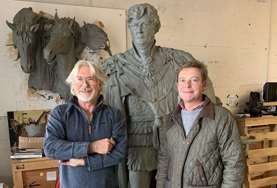 Craig Mackinlay being given a preview of Dominic Grant’s sculpture of George IV