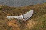 The detached wing of the microlight at the bottom of the cliffs. Picture: MIKE SMITH