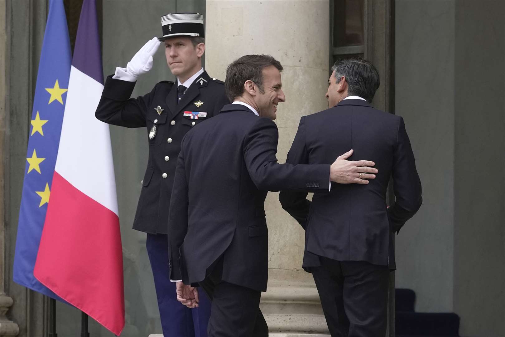 President Emmanuel Macron welcomes Rishi Sunak to the Elysee Palace (Kin Cheung/PA)