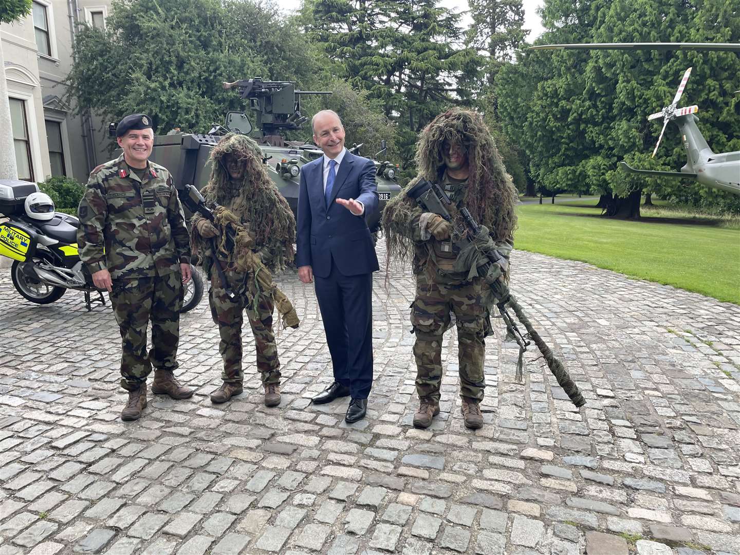 Tanaiste and Minister for Defence Micheal Martin and Defence Forces Chief of Staff Lt Gen Sean Clancy chat to Irish soldiers (Gráinne Ní Aodha/PA)