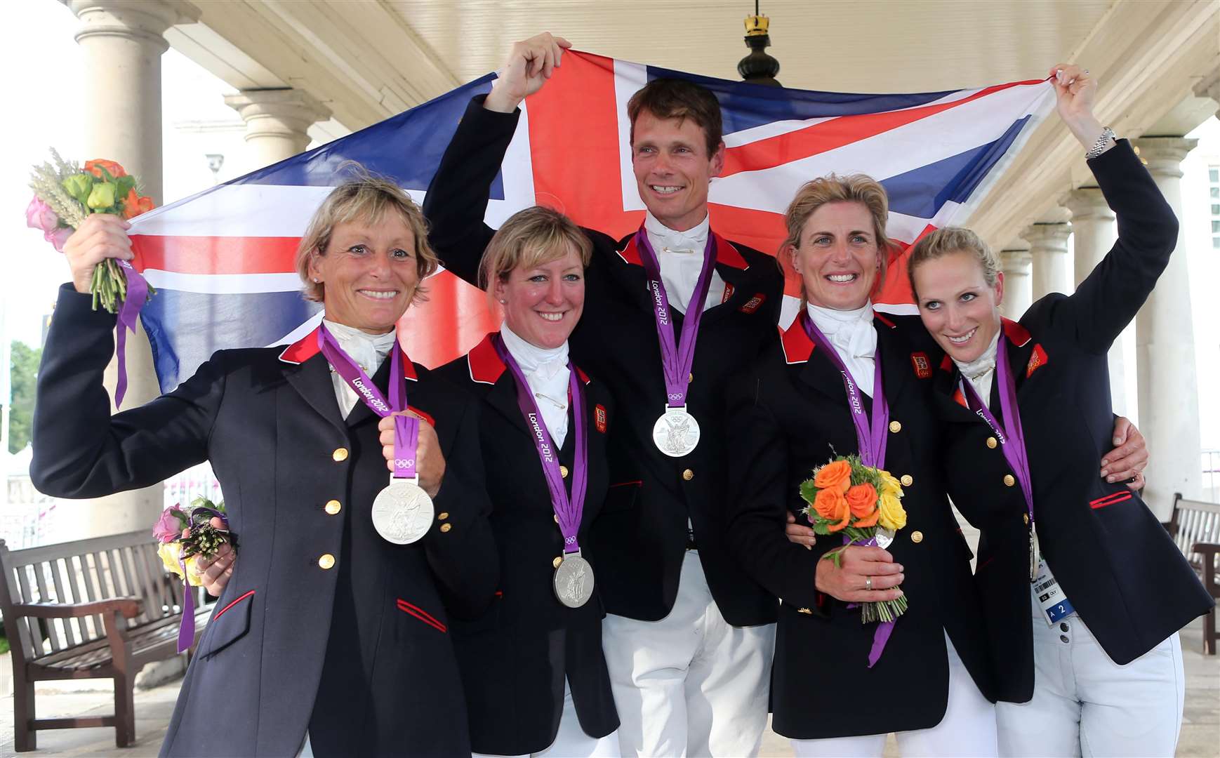 The Team GB eventing team celebrate their silver Olympic medal in 2012 (Steve Parsons/PA)