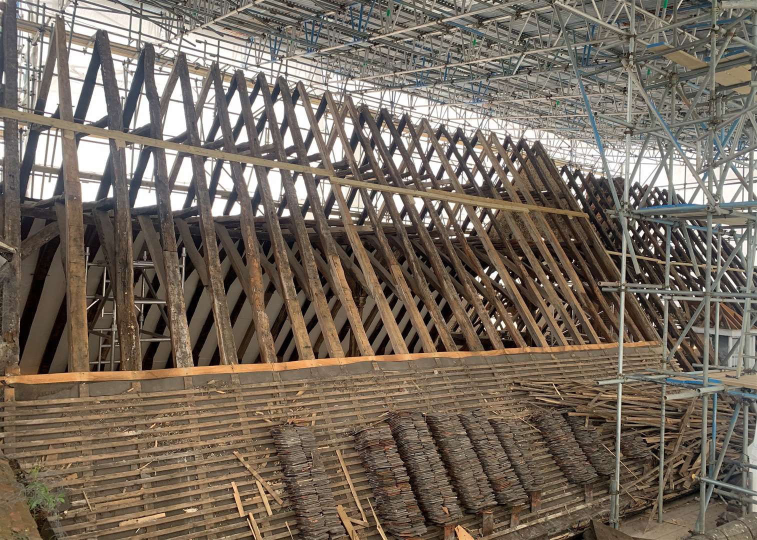 Work has started on replacing the roof tiles of the Poor Priest's Hospital on Stour Street, Canterbury