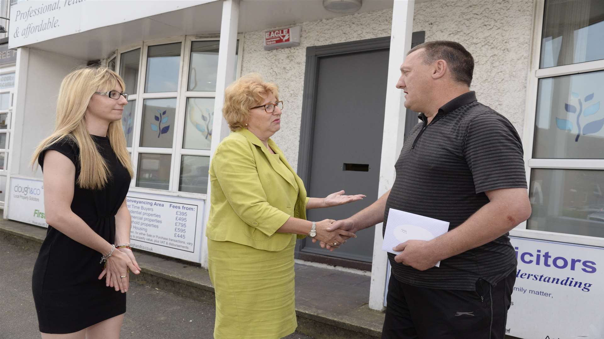 Victoria Jeffery and Janice Stevens thank neighbour Gary Sims who called the police after a smash and grab at Clough & Co Solicitors in Halfway