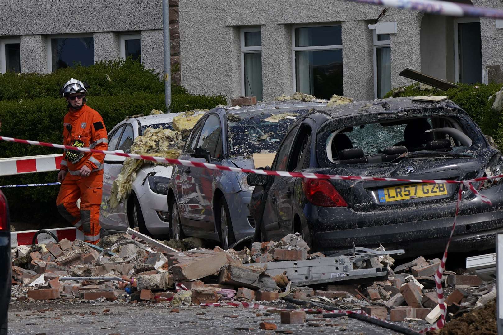 Cars in the street were also damaged (Danny Lawson/PA)