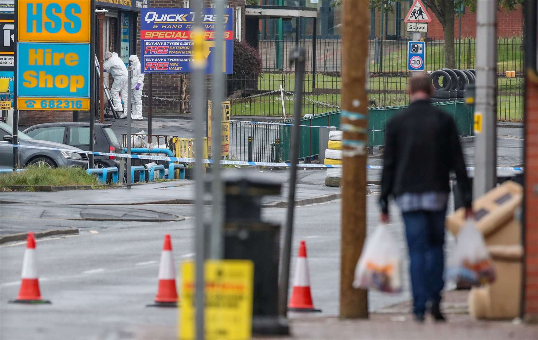 Forensics officers at the scene in King Street (Peter Byrne/PA)