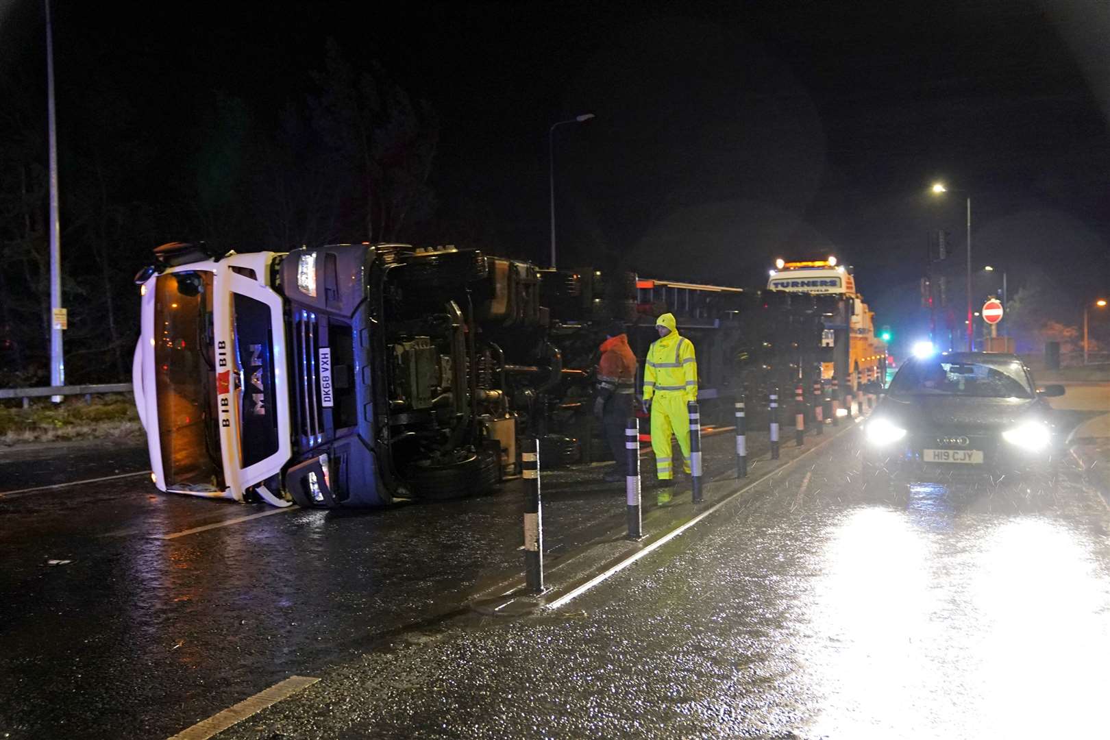 A lorry blown over in high winds blocks the A179 near Hartlepool, County Durham (Owen Humphreys/PA)