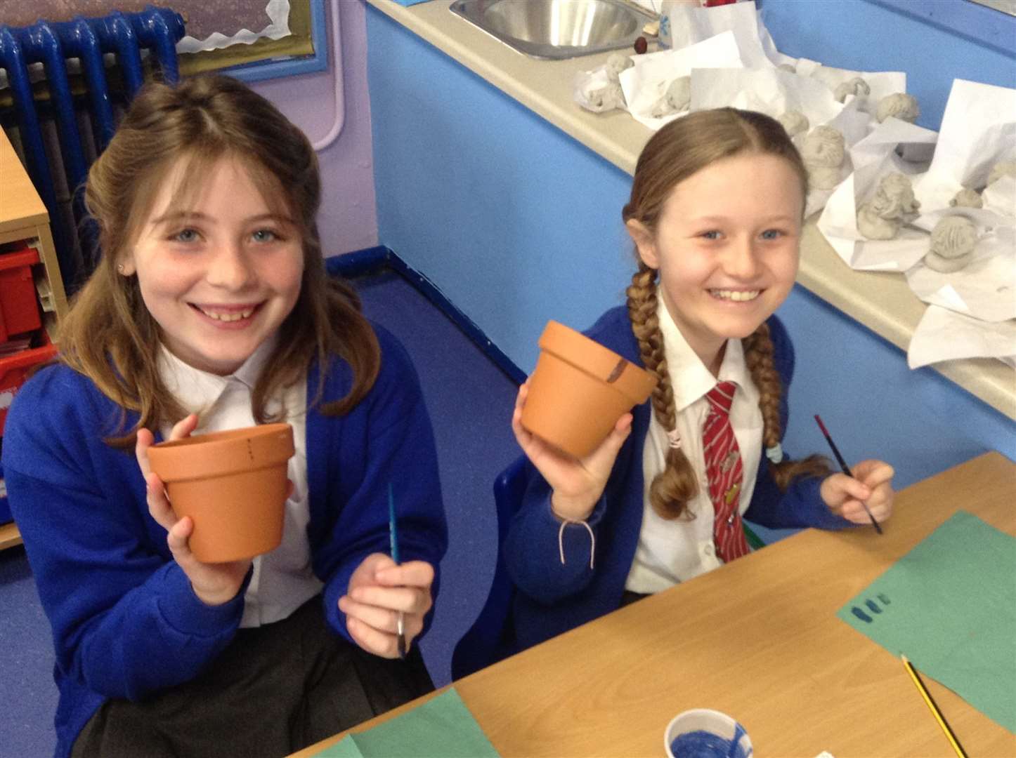Isabella and Grace planting 'rainbow' seeds on their first day back at Minster Primary School, Sheppey, after the coronavirus lockdown