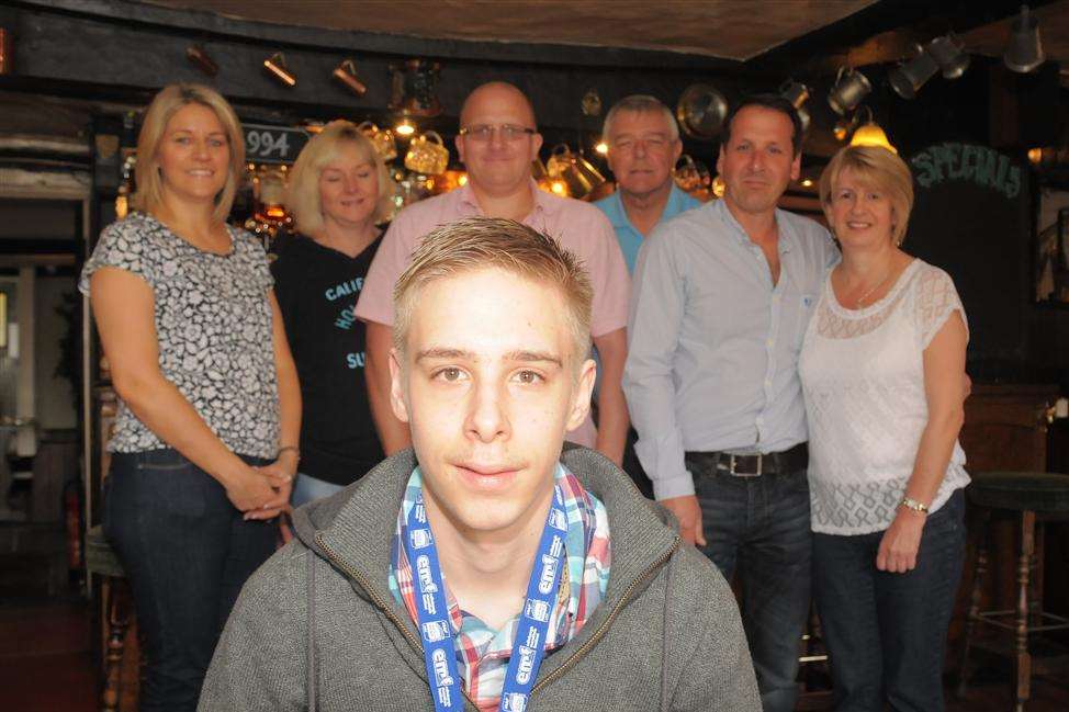 Ben Fuller in his new wheelchair with Karen Tivers, Debbie and Paul Hockley, Keith Dorey, Wayne Fuller and Sally Whiffin.