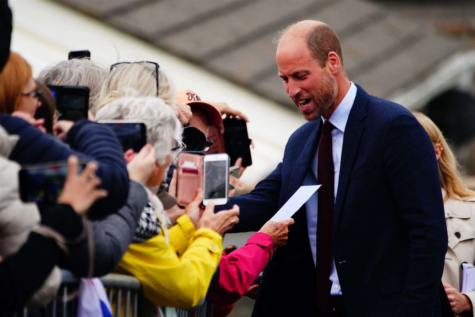 William chatting to well-wishers outside the school (Ben Birchall/PA)