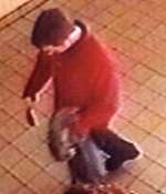 A CCTV image of the man police wish to question. It was captured at West Malling railway station