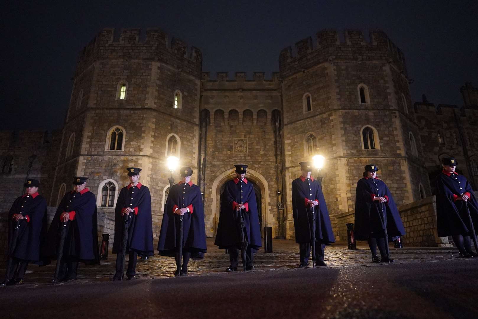 Castle Wardens observe the national minute’s silence in memory of the Queen at Windsor Castle (Victoria Jones/PA)