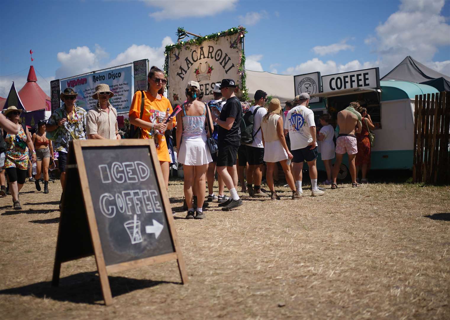 Festivalgoers queue for refreshments at the Glastonbury Festival (Yui Mok/PA)