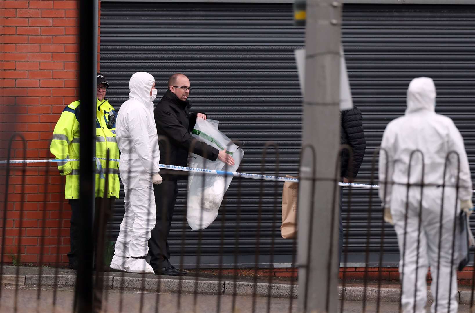 Police officers at the scene on King Street (Peter Byrne/PA)