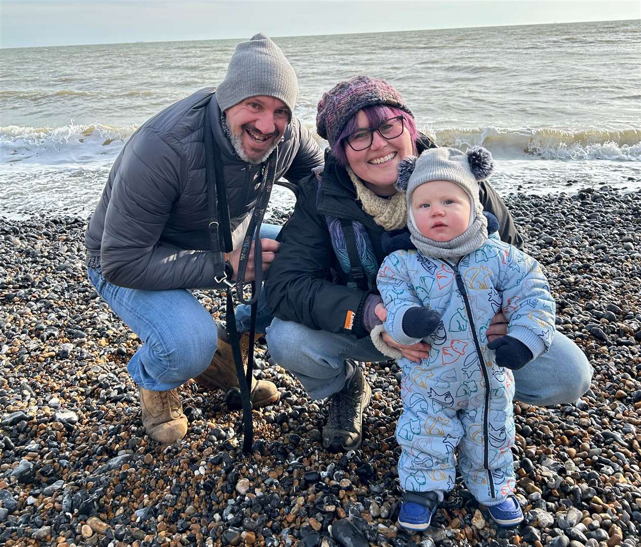 Sam Walker with her husband David and their son Logan. Picture: Emma Rossiter