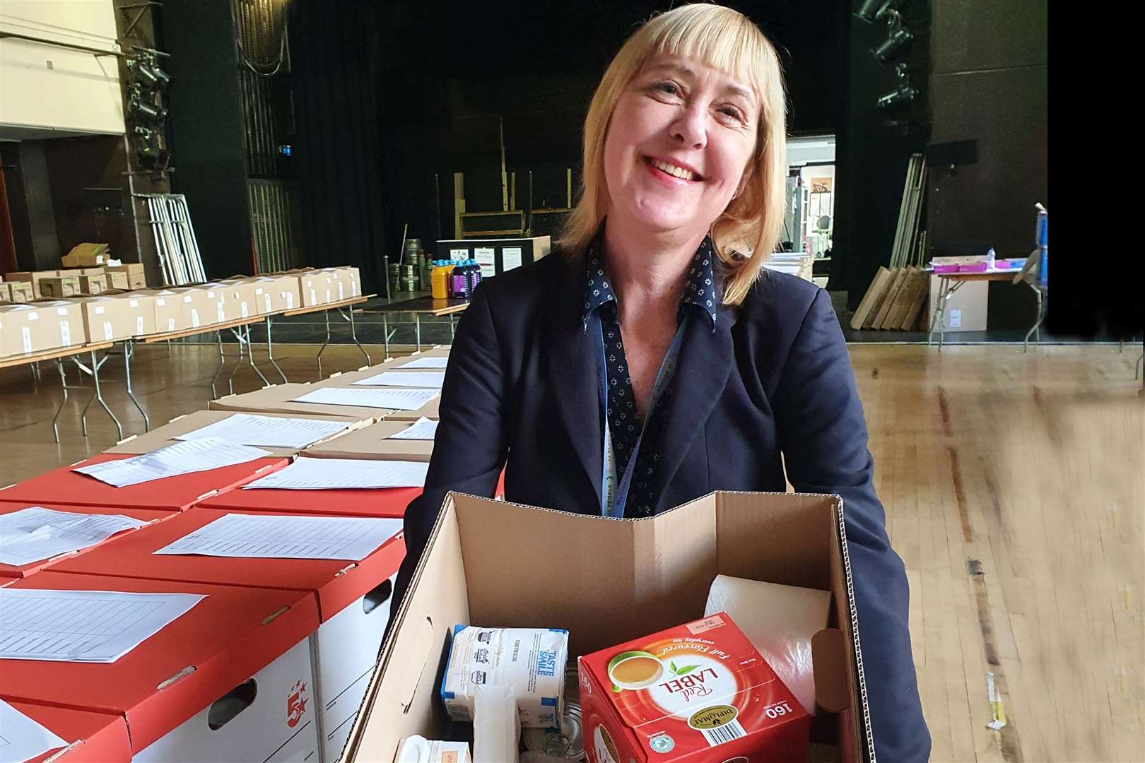 A council worker prepares a food parcel to deliver to a vulnerable resident