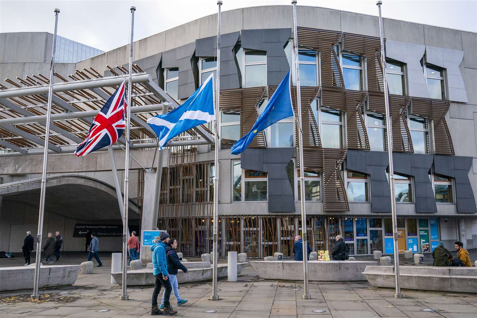 Flags were lowered to half-mast outside the Scottish Parliament while Holyrood paid tribute to Alex Salmond (Jane Barlow/PA)