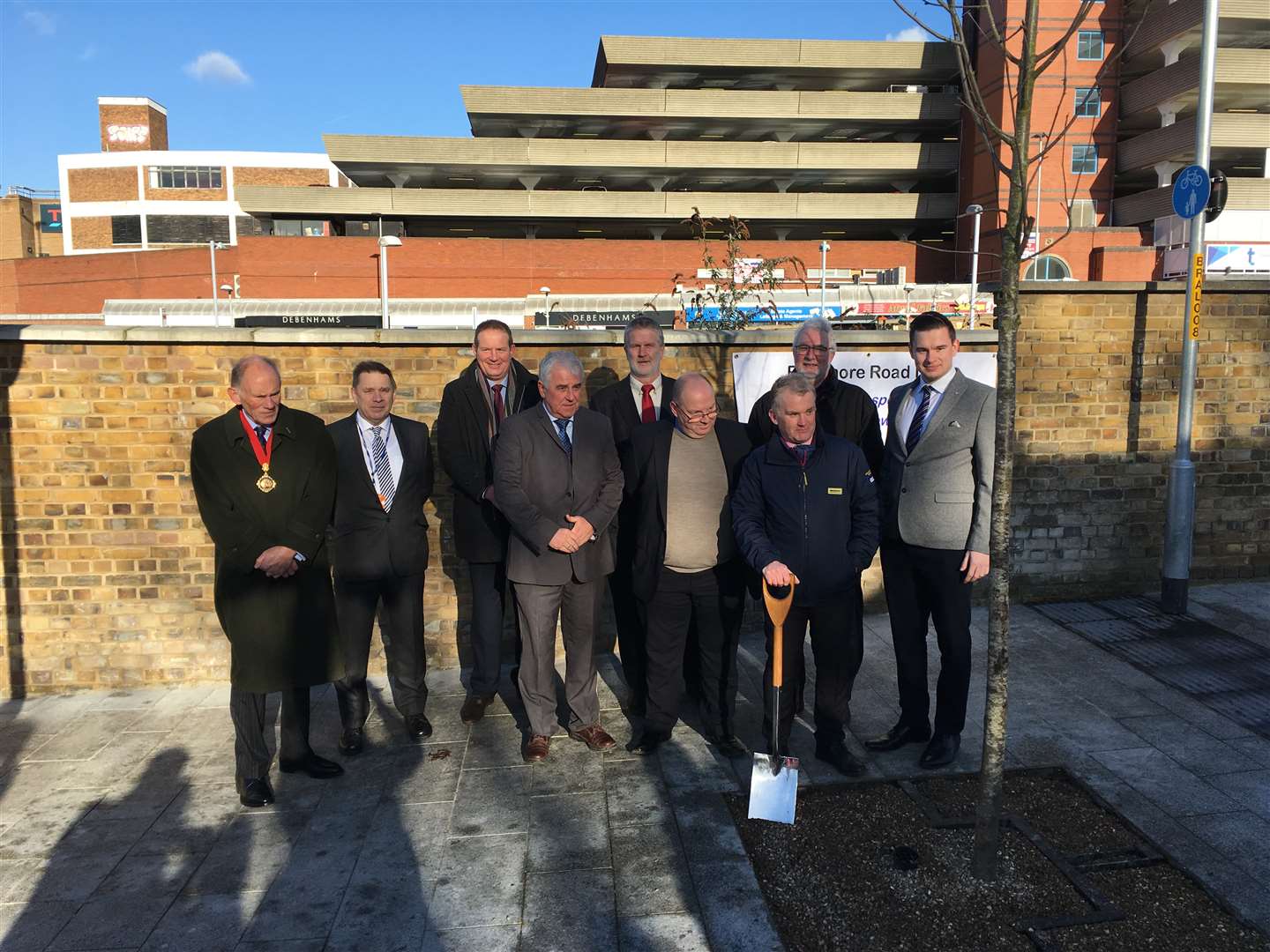 Council officials and contractors gather to celebrate the completion of new road improvements in Rathmore Road