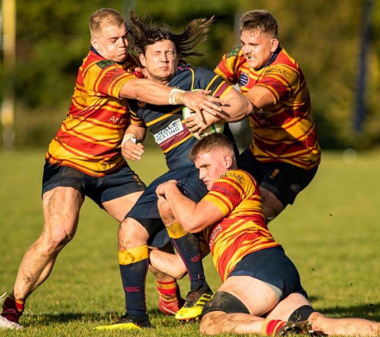 Medway’s Todd Johnson, Dan Jackson and Josh Mason (bottom) team up against Old Colfeians. Picture: Jake Miles