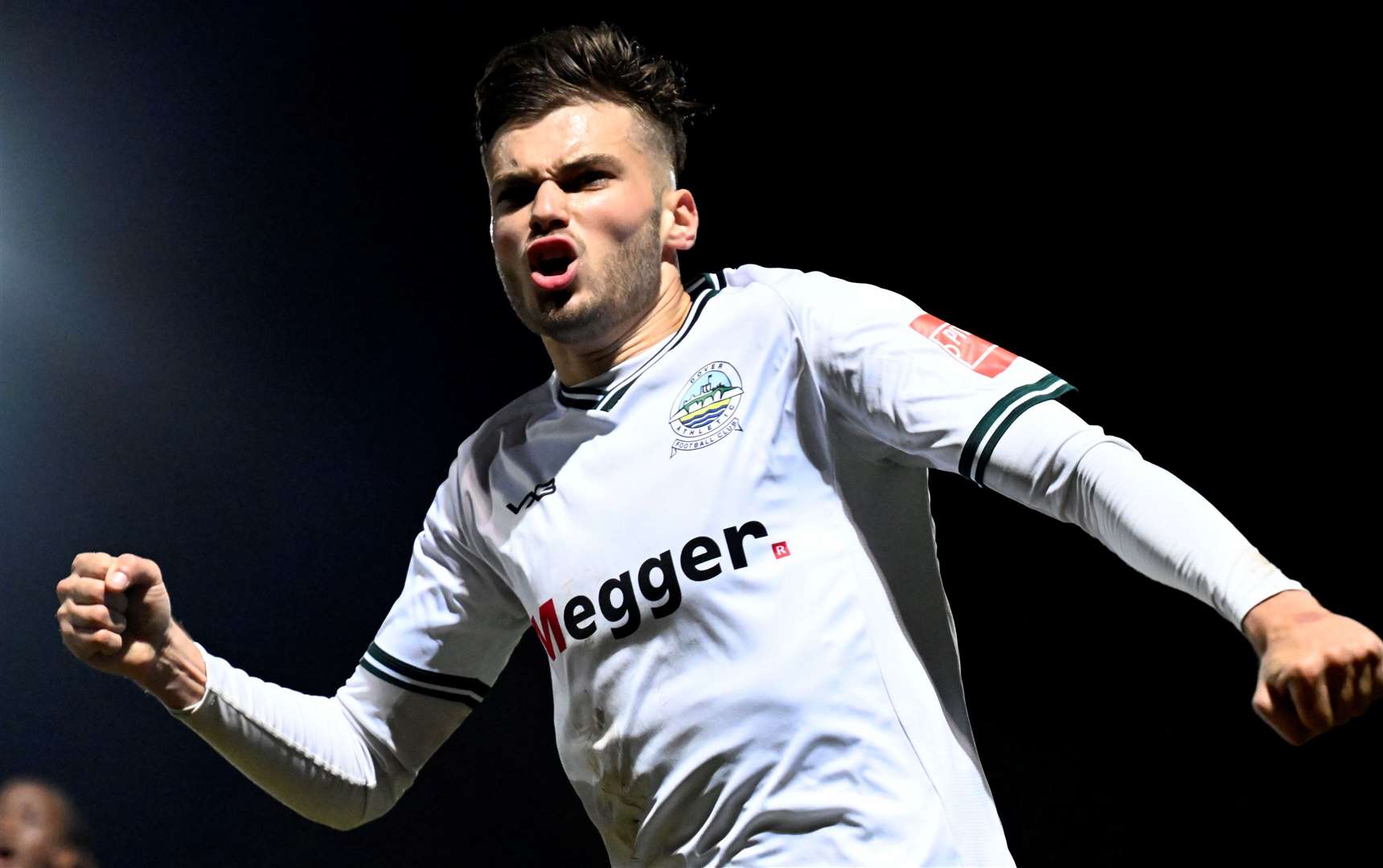 George Nikaj celebrates scoring what proves Dover’s winning goal in their 3-2 Isthmian Premier victory against Canvey Island on Saturday. Picture: Barry Goodwin