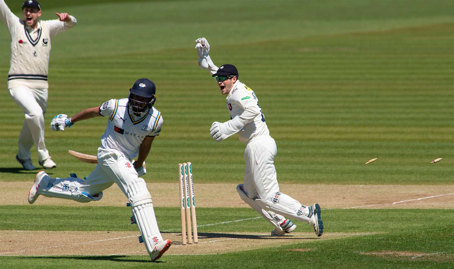 Kent's Ollie Robinson celebrates as Jack Leaning is run out by a direct hit from Heino Kuhn