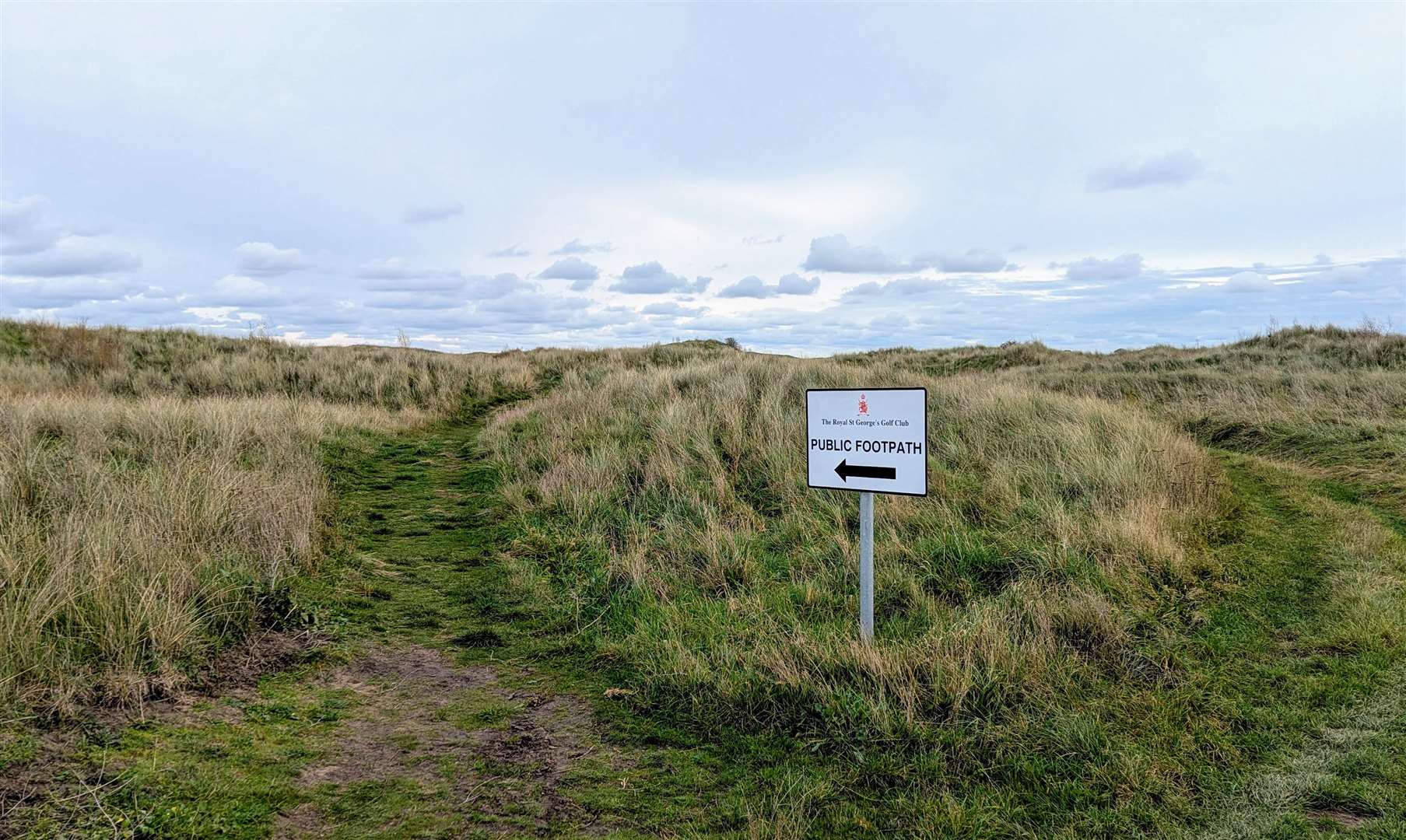 A sign points the way across The Royal St George's Golf Club