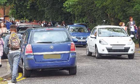 Pupils from a nearby secondary school add to the congestion outside Brunswick House at the end of the school day