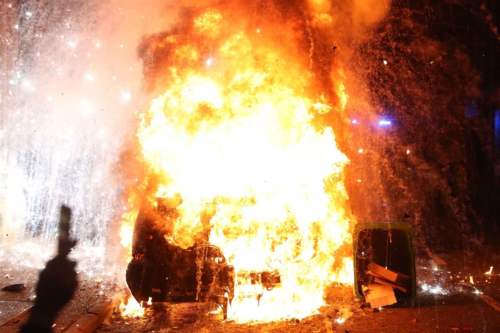 A vandalised police van explodes outside Bridewell Police Station (Andrew Matthews/PA)