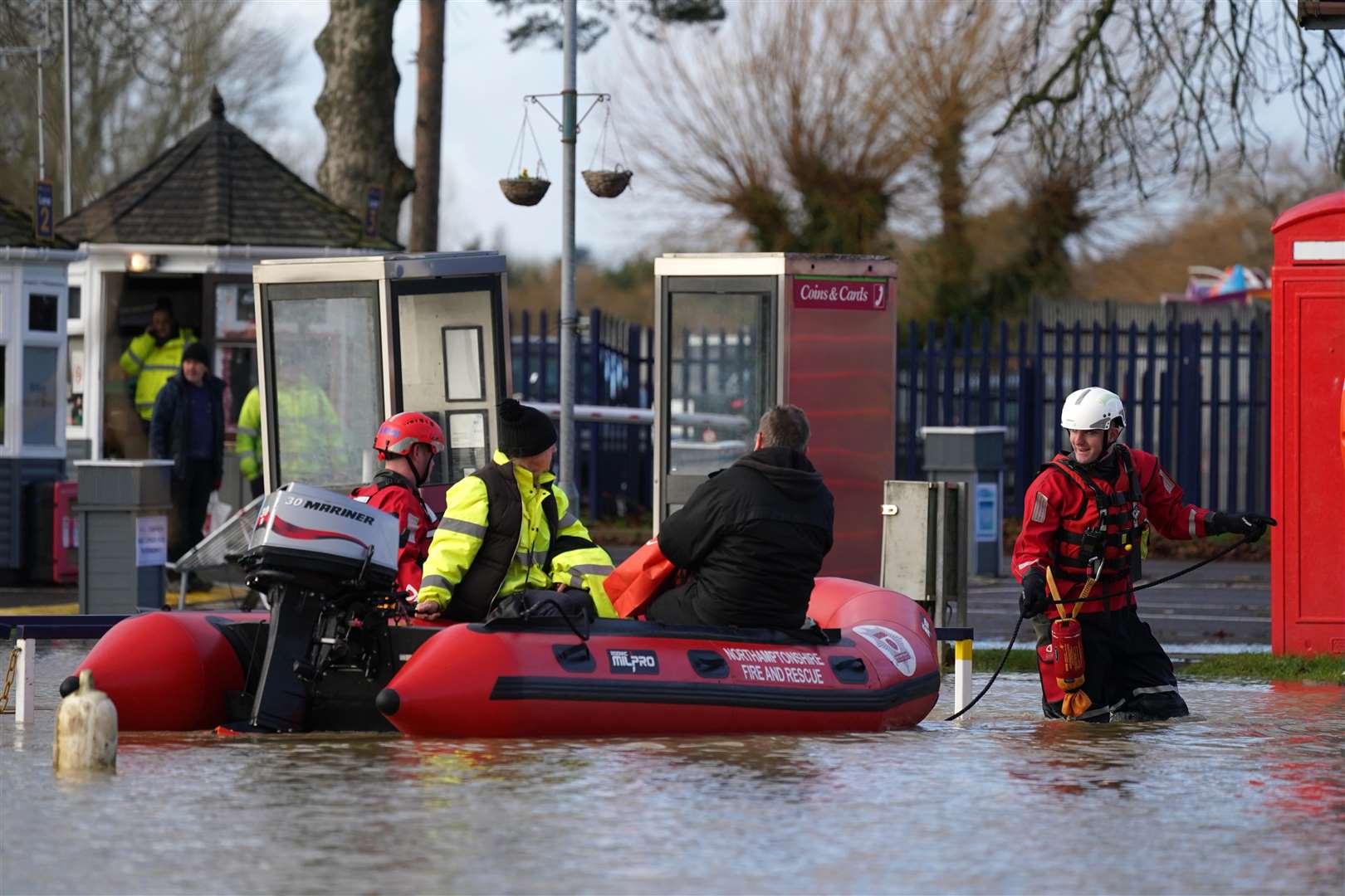 Northamptonshire Fire and Rescue Service rescue people from houseboats at the Billing Aquadrome in Northampton (Jacob King/PA)