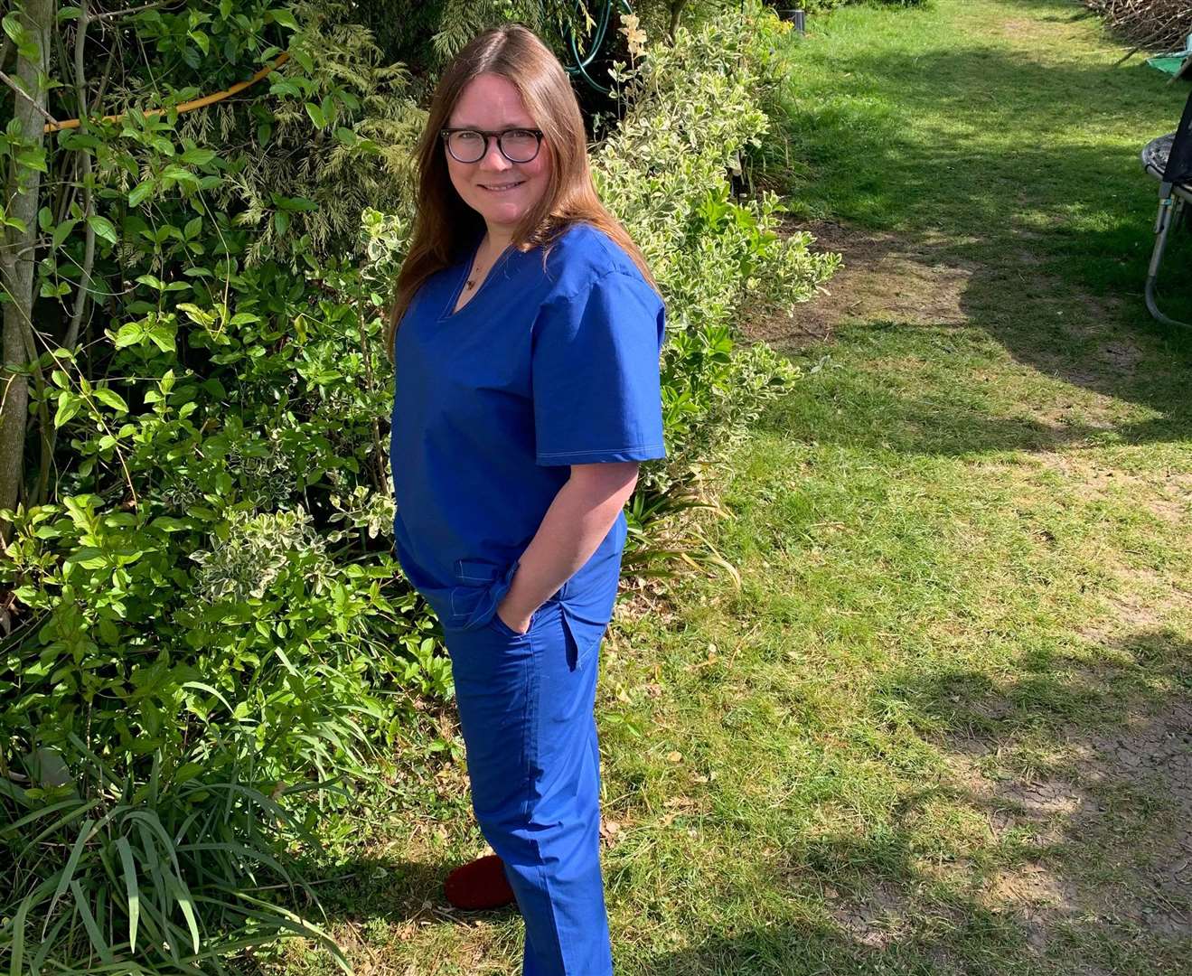 Sewing volunteer Daniella modelling scrubs she has made. Picture: Melissa Dawkins