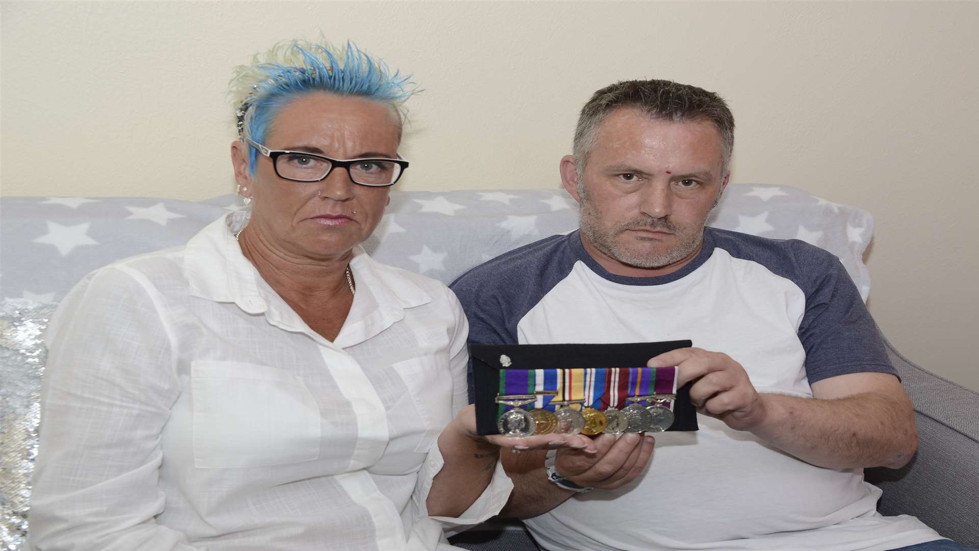 Trevor and Elaine Nutt with Mr Nutt's service medals.